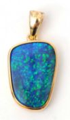 A 9ct opal pendant, with off-oval opal in collet mount stamped 375 with Birmingham assay mark and