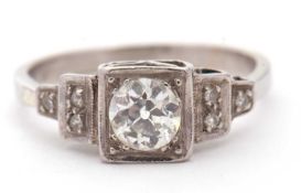 An Art Deco diamond ring, the central old mine cut diamond, estimated approx. 0.75cts, in a