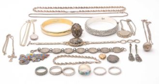 A mixed lot of silver and white metal jewellery, including necklaces, pendants, a bangle, a silver