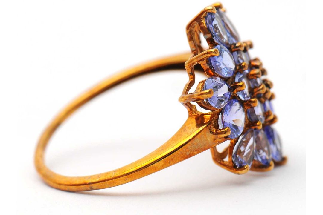 A 9ct tanzanite cluster ring, the cluster formed of round, oval and pear shape tanzanites, with - Image 2 of 7