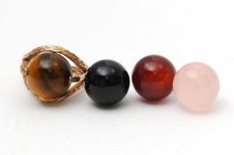A 9ct interchangeable gemset ring, the 9ct gold claw mount with interchangeable gemset spheres of