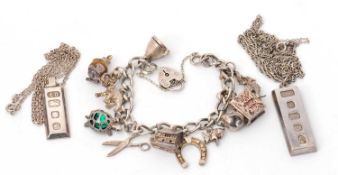 Two silver ingot necklaces, both with silver chains, and a silver charm bracelet, 102g gross, (3)