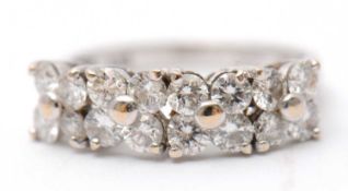 An 18ct diamond ring, set with round brilliant cut diamonds, total estimated approx. 0.36cts, with