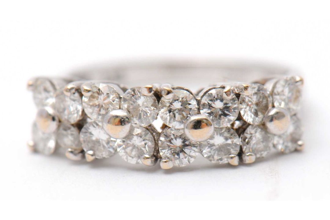 An 18ct diamond ring, set with round brilliant cut diamonds, total estimated approx. 0.36cts, with - Image 1 of 8