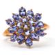 A 9ct tanzanite cluster ring, the cluster formed of round, oval and pear shape tanzanites, with - Image 1 of 7