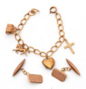 A charm bracelet and cufflinks: the unmarked curblink bracelet set with most charms stamped 375 or