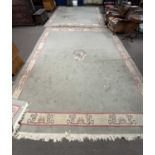 A pair of large late 20th Century Nepalese wool floor rugs with dragon detail to centre