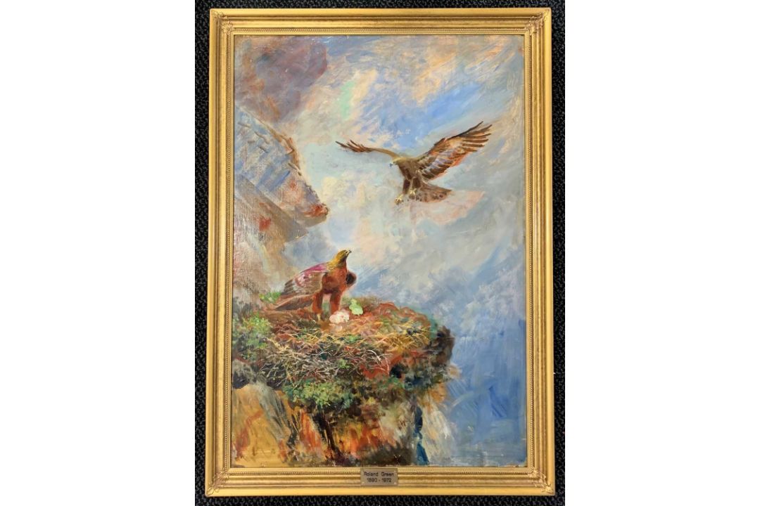 Attributed to Roland Green (1896-1972), Nest guarding eagles on a rocky cliff face, oil on canvas,
