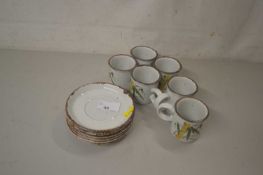 Group of Mid winter pottery cups and saucers