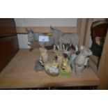 Two mdels of donkeys and other smaller models by Tetley and Sheratt & Simpson of dogs and cats