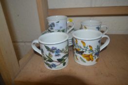 Group of four Portmerion cups and saucers with botanical style prints
