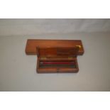 Wooden pencil box and one other