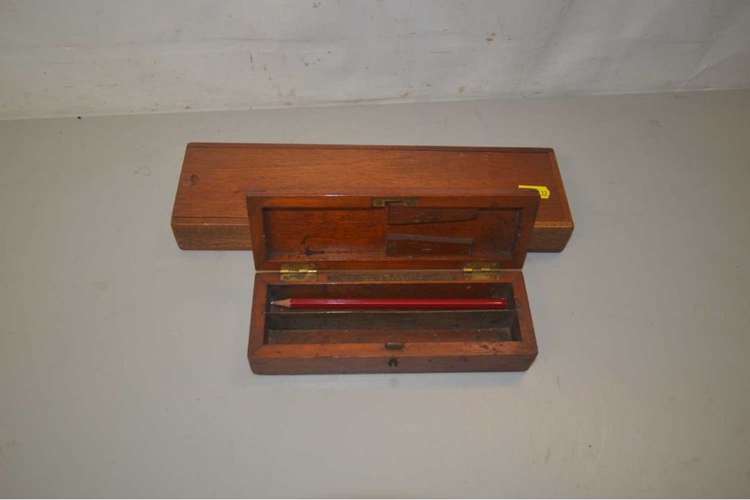 Wooden pencil box and one other