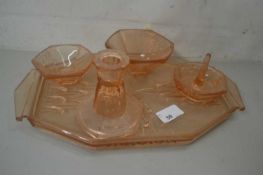Pressed glass tray with various dishes and candle stick