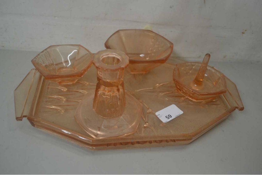 Pressed glass tray with various dishes and candle stick