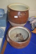 Large glazed pottery pot together with a smaller example