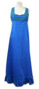 A blue shift dress by Miss Nouvelle, with blue and green and gilt thread striped bust and shoulders,