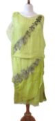 A 1920's beaded dress, the double layer chiffon overlay lime green shift dress with asymetrical