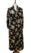 A mid 20th century patterned black satin button through dress , with covered button front (no