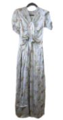 A 1930's floral satin dress, with central gathered oval panel, tie waist and side zip, short