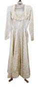 A 1940's cream patterned satin wedding dress,with pleated crossover bust, fitted waist, long skirt