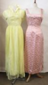 Two c.1950's dresses, to include a lemon yellow chiffon dress with padded scalloped collar and