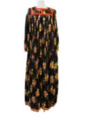 Jean Varon: a mid 1970's black and printed floral dress, size 14, with accompanying photo taken at