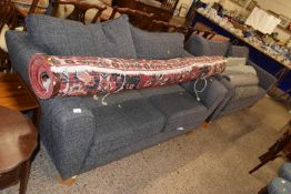 A pair of modern marl grey three seater sofas