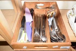 A cutlery tray and assorted utensils