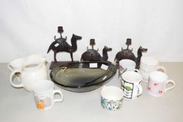 A smoked glass fruit bowl, various mugs, camel formed candlesticks etc