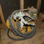 An F.W. Bracket & Co Ltd stationary cast iron water pump, hand-painted in yellow