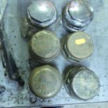 A set of four early brass hub caps, annotated Cooke & Sons Builders Lincoln; together with four