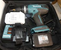 A Makita lithium 18volt battery operated hand drill