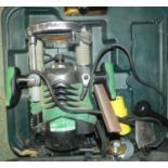 A Hitachi M12V2 heavy duty plunge router, in carry case