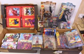 Four trays containing Marvel-related figure sets and books to include Diamond Select Toys Venom,