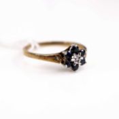 An Edwardian style 9ct gold sapphire & diamond point set flower head cluster ring, size O-P, 1.6g