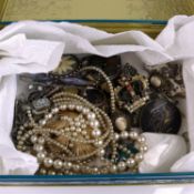 Assorted costume jewellery to include faux pearl necklaces, paste set brooches, ear clips etc