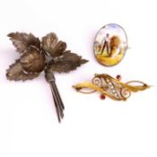 An Edwardian 15ct gold seed pearl and ruby set brooch, with steel pin, 4.8cm, 3.5g; together with