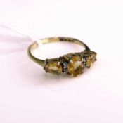 A modern 9ct gold yellow topaz and diamond point set dress ring, size R, 2.3g
