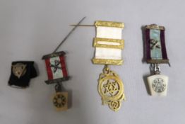 Four various Masonic medals with ribbons
