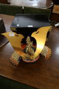 Japanese Kabuto miniature Samurai helmet on stand, housed in a black painted cabinet