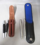 Porsche design ballpoint pen and pencil in leather case, together with a Faber-Castell ballpoint pen
