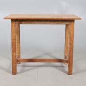A GORDON RUSSELL LIGHT OAK SIDE TABLE.