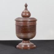 A LARGE TURNED LIGNUM VITAE WASSAIL BOWL AND COVER.