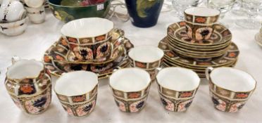 A Royal Crown Derby Imari pattern part tea service, to include cream jug; cups; saucers; sugar bowl,