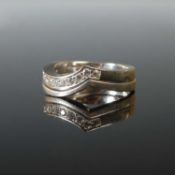 A 950 grade platinum and diamond half hoop eternity ring, set with twelve round brilliant cut