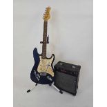 A blue Encore six string electric guitar with tremolo arm along with a Sound City SC 10 amplifier