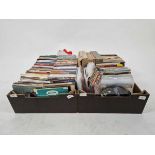 Two trays containing a large quantity of 45RPM records by various artists to include Praying Mantis,