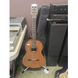 A Cordoba Iberia Series Model Dolce acoustic guitar with stand, rest, knee rest and bag