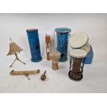 A selection of percussion instruments to include bamboo wind chime, hand crafted rainstick, hand